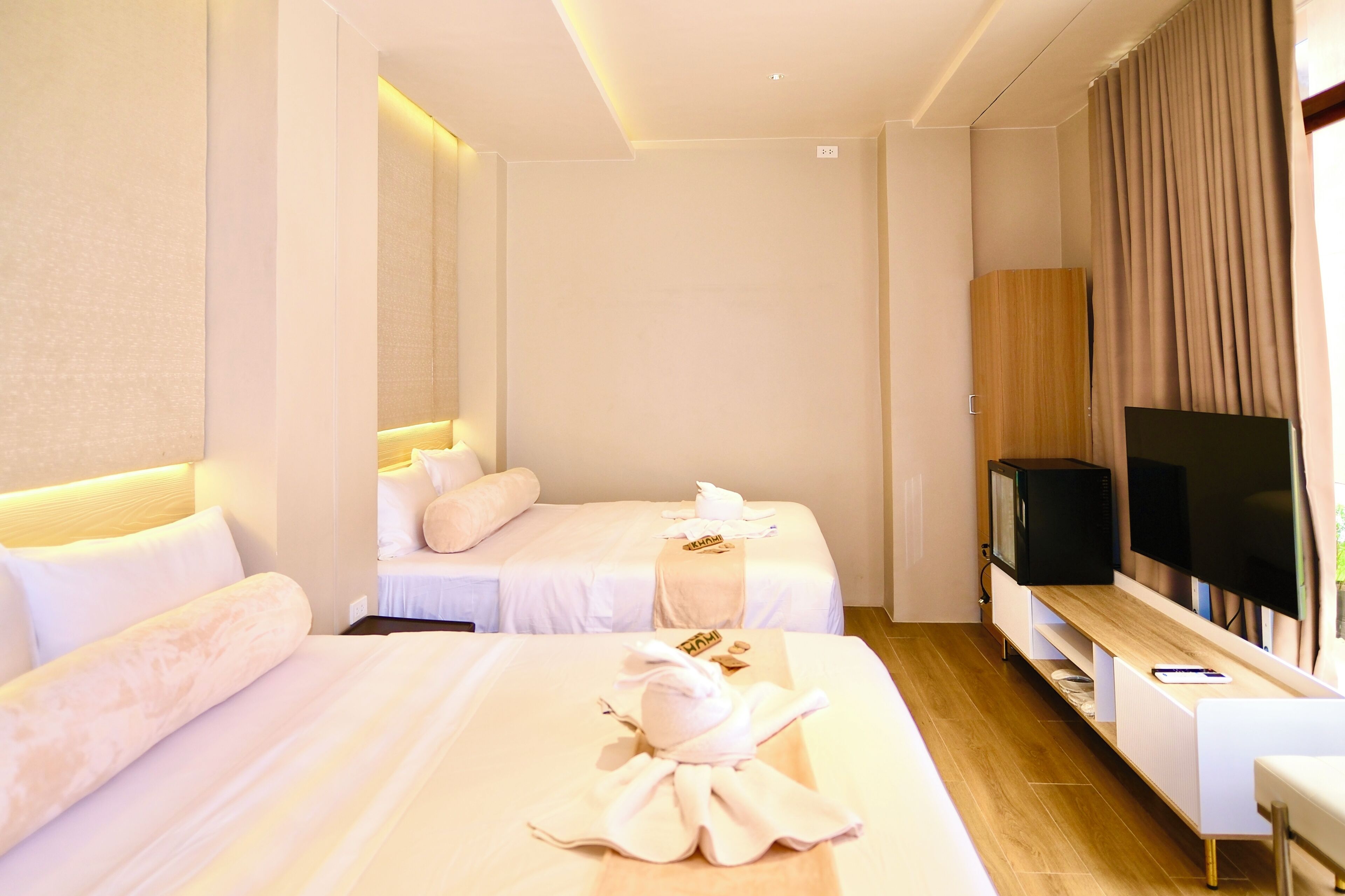 Deluxe Quadruple Room, Pool View | In-room safe, desk, laptop workspace, blackout drapes