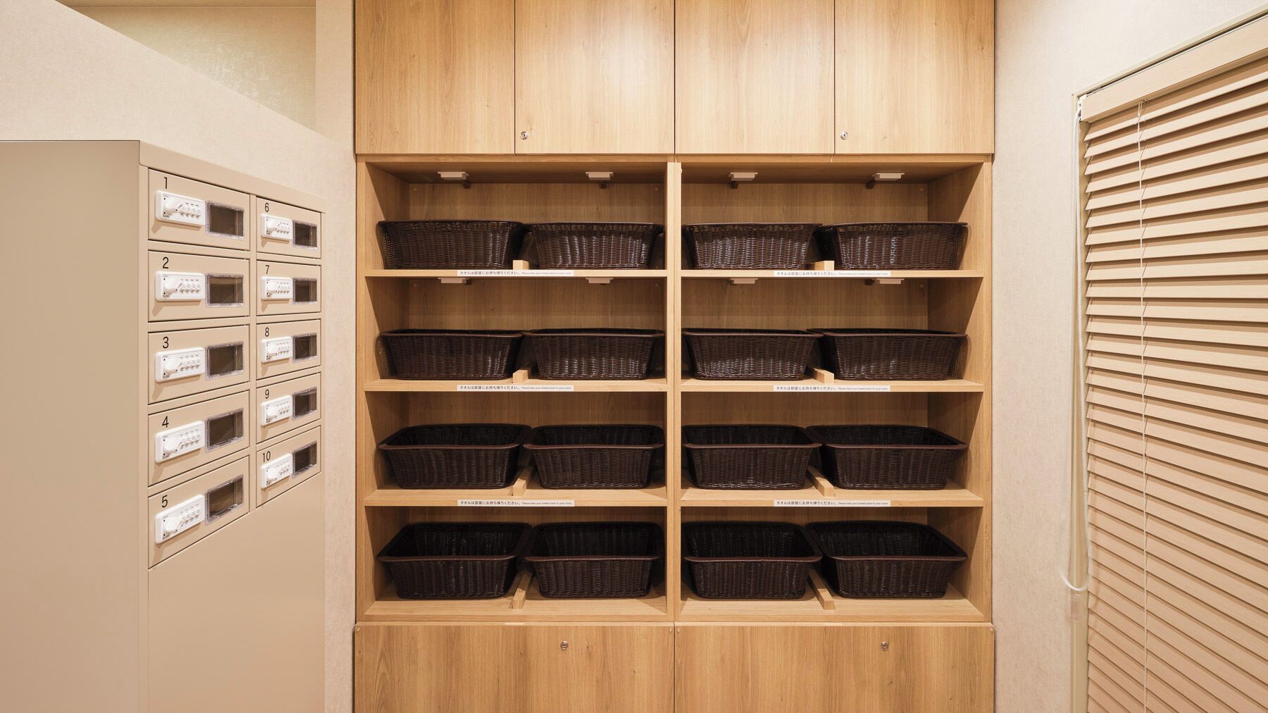 A wooden storage unit with multiple shelves and compartments, some with baskets.