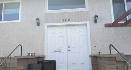Central 2 bedroom suite, full kitchen, living room with private entrance.