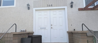 Central 2 bedroom suite, full kitchen, living room with private entrance.