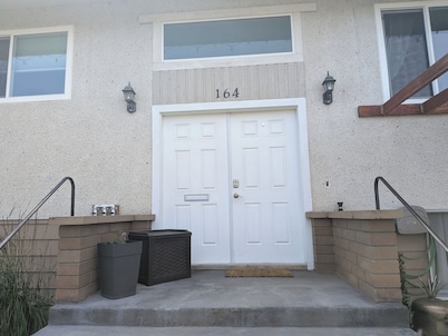 Central 2 bedroom suite, full kitchen, living room with private entrance.