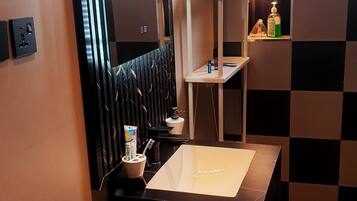 Bidet, towels, soap, toilet paper