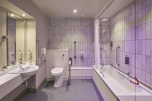 A modern bathroom with a sink, toilet, and bathtub. - Premier Inn Manchester City Centre - Northern Quarter (Manchester)