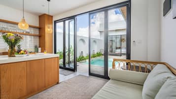 Standard Villa, Pool View | Living area | 32-inch LED TV with cable channels