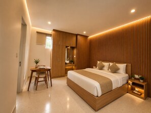 A modern bedroom with a large bed, a desk, and a wardrobe. - HOTEL K Seminyak (Keroboken Kelod)