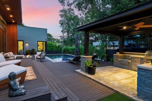 A deck with outdoor seating, a pool, and a barbecue area. - South Austin Retreat • Pool + Fire Pit • Near South Congress | Oaklane Zen (Austin)