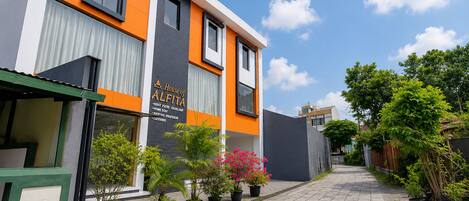 A modern building with a sign that reads 'House of Alejandra.'