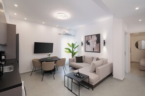 Comfort Apartment | Living area | 50-inch Smart TV with satellite channels - Classy & Lux Apartment in Athens (Athina)