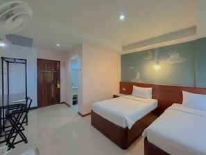 A hotel room with two beds, a ceiling fan, a nightstand, and a wall mural. -  Loei Buri Hotel by Alphatel (Mueang Loei)