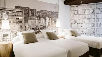 Desk, laptop workspace, bed sheets