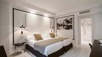 Desk, laptop workspace, bed sheets