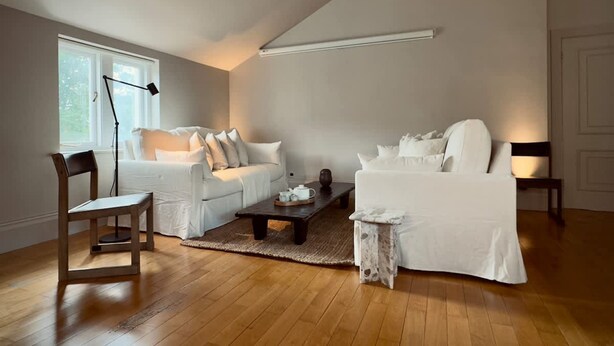 A spacious living room with a high ceiling, a large window, and a modern design. - Grand 2BR Penthouse Projector Hyde Park (London)