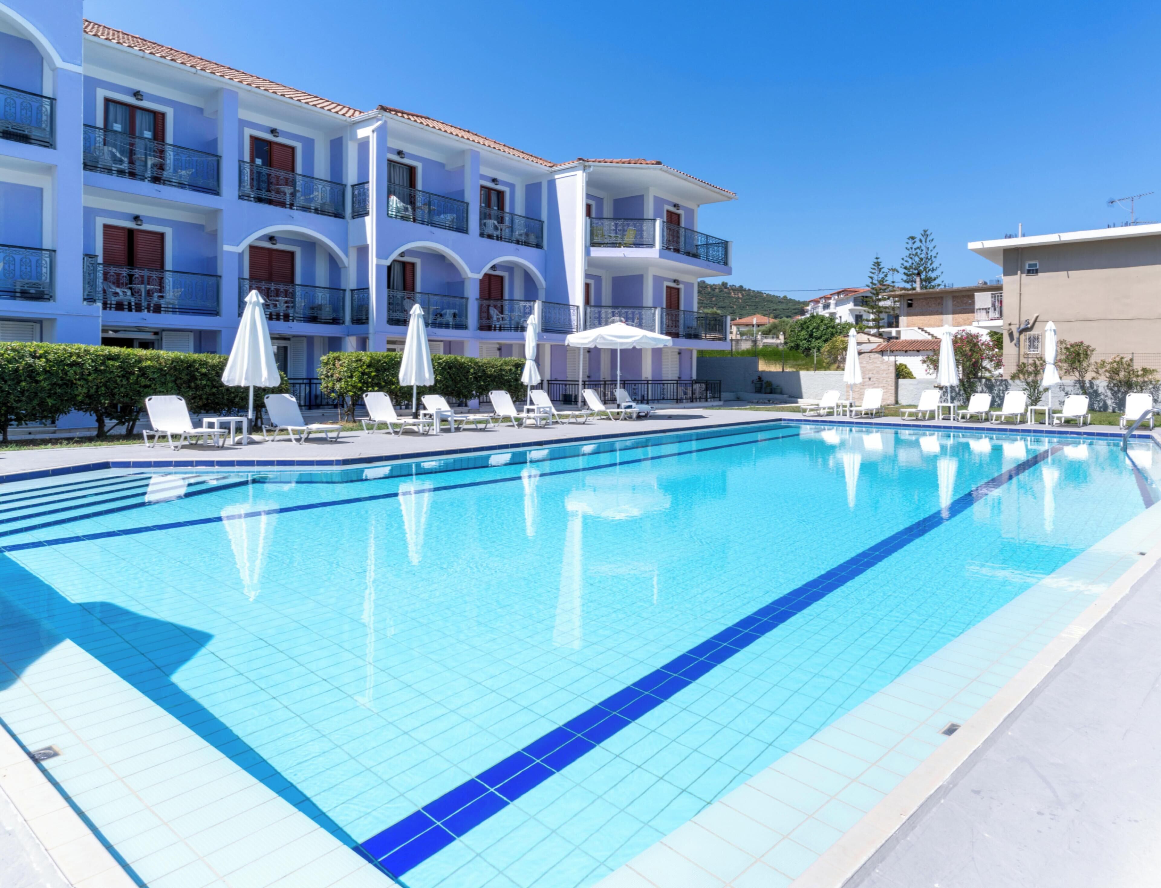 Seasonal outdoor pool, open 10:00 AM to 6:00 PM, pool umbrellas