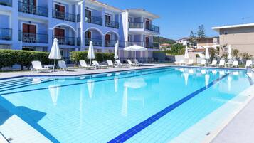 Seasonal outdoor pool, open 10:00 AM to 6:00 PM, pool umbrellas