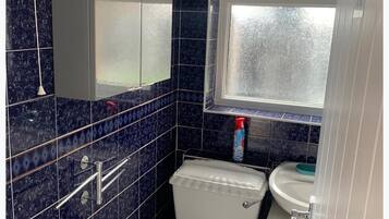 Separate bathtub and shower, deep-soaking bathtub, towels