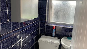 Separate bathtub and shower, deep-soaking bathtub, towels