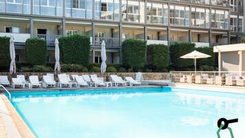 Outdoor pool, open 10:00 AM to 7:00 PM, pool umbrellas, pool loungers