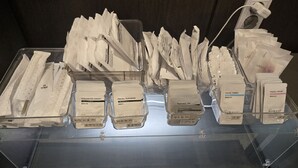 A display of various skincare products in clear containers. - Hotel Lantana (Changwon)