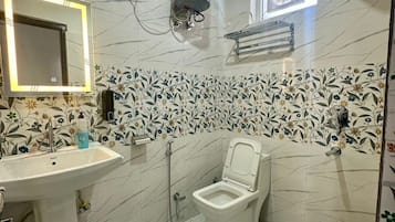 Shower, towels, soap, toilet paper