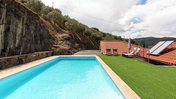 Seasonal outdoor pool, pool umbrellas, pool loungers