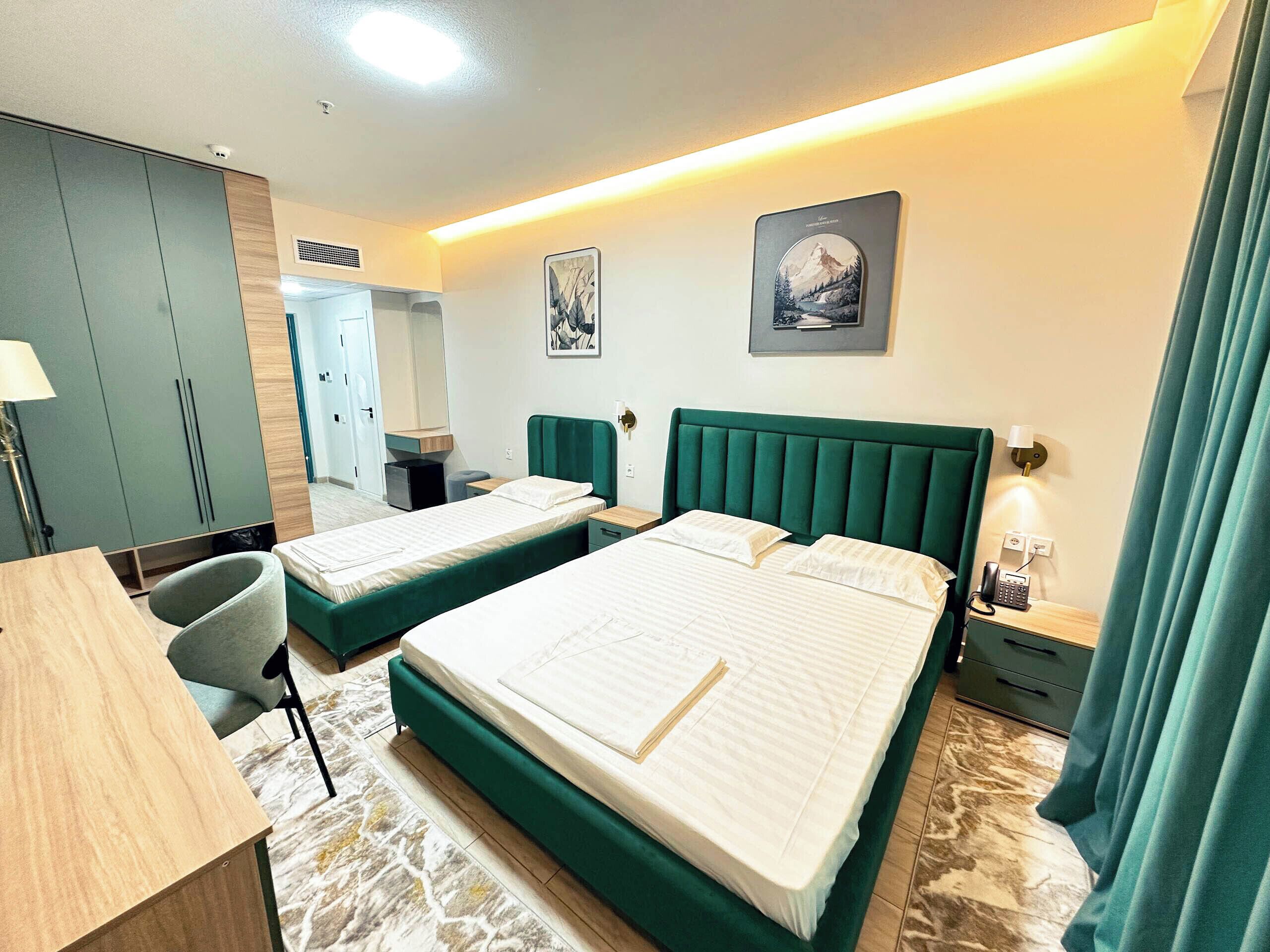 Family Room, Balcony, City View | In-room safe, blackout drapes, iron/ironing board, free WiFi