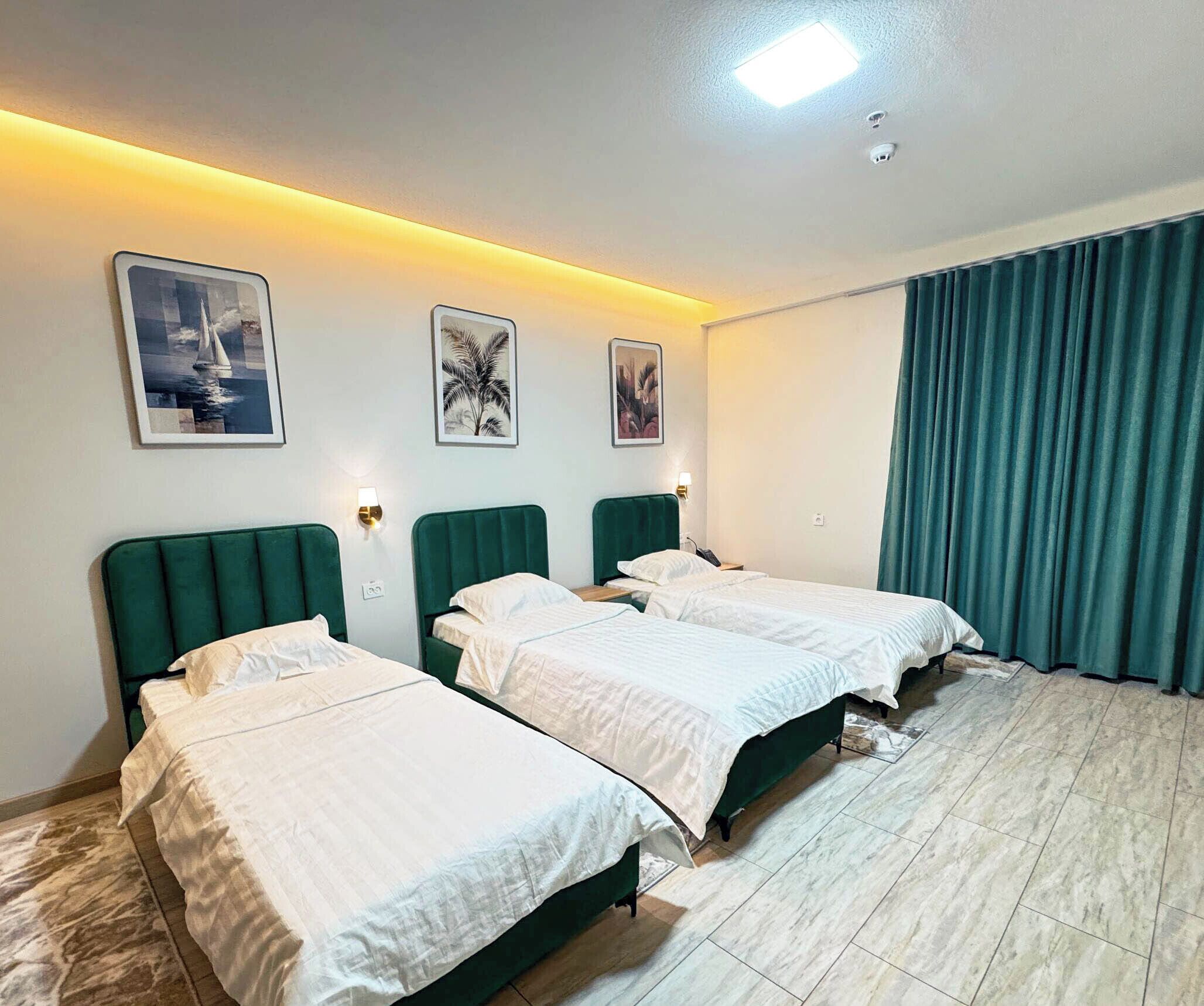 Deluxe Triple Room, Balcony, City View | In-room safe, blackout drapes, iron/ironing board, free WiFi
