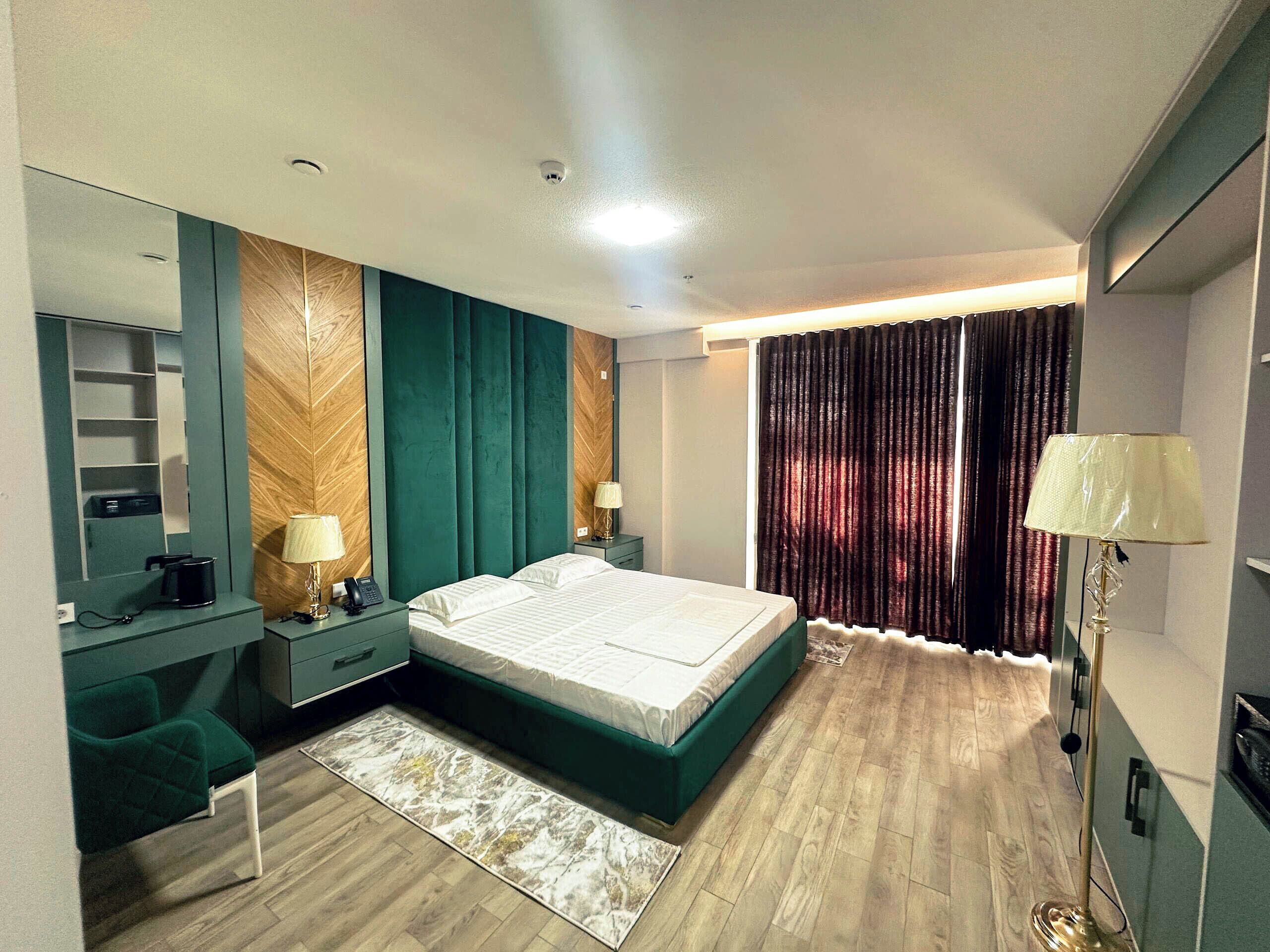 Junior Suite, Balcony, City View | In-room safe, blackout drapes, iron/ironing board, free WiFi