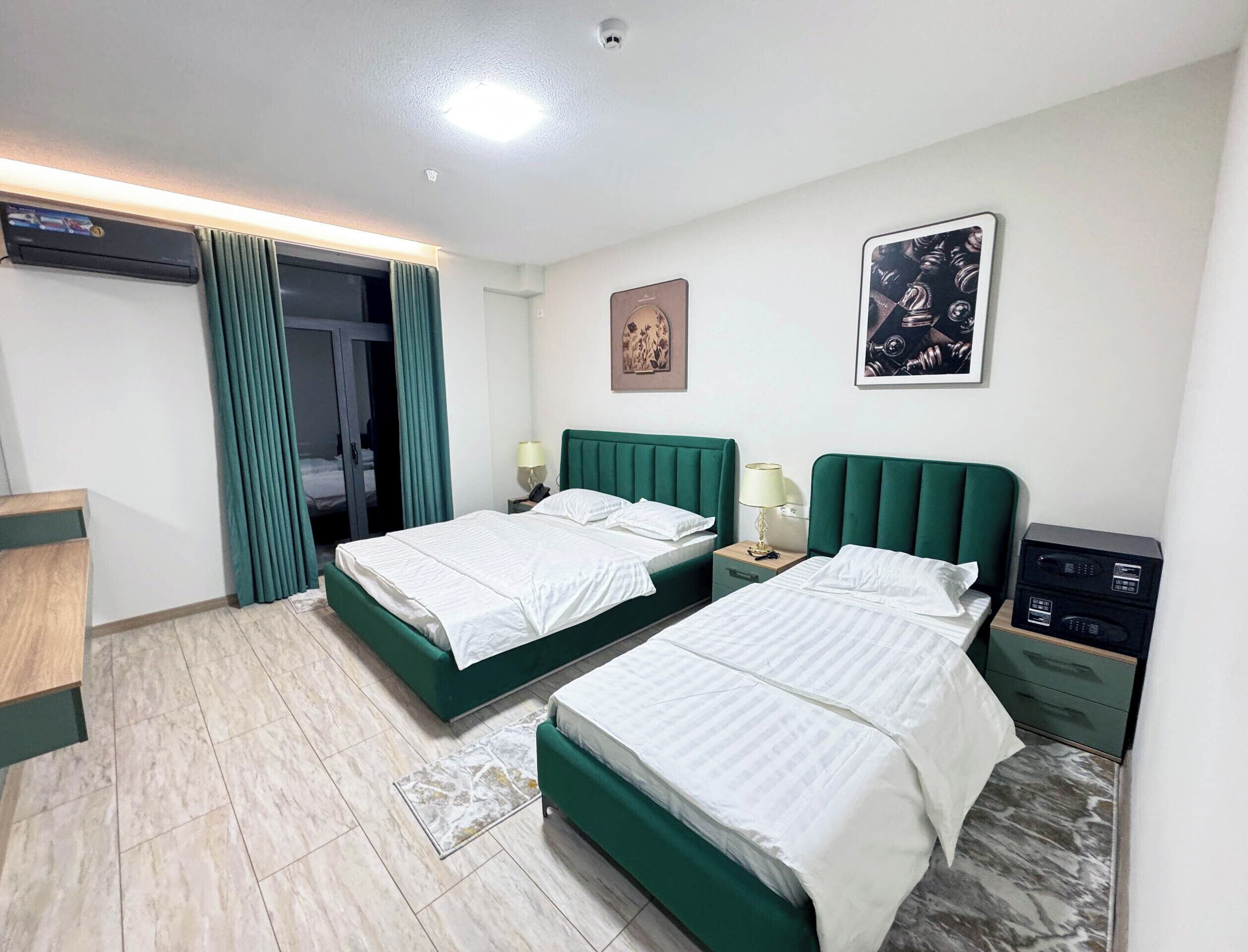 Family Suite, Balcony, City View | In-room safe, blackout drapes, iron/ironing board, free WiFi