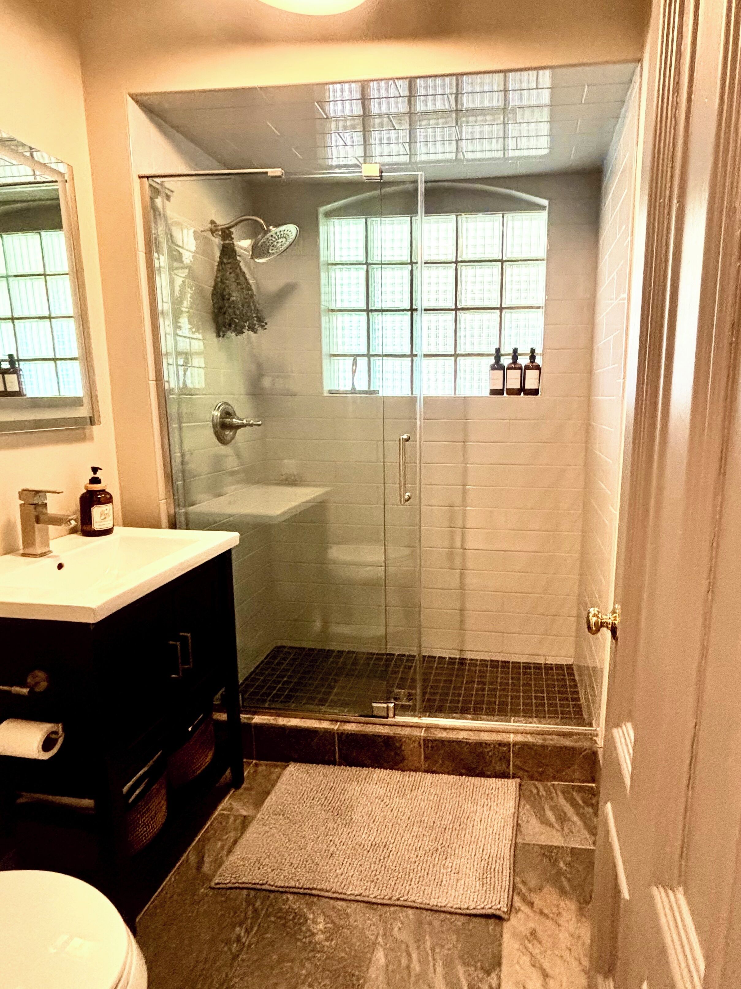 Shower, towels, soap, toilet paper