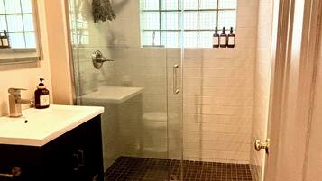 Shower, towels, soap, toilet paper