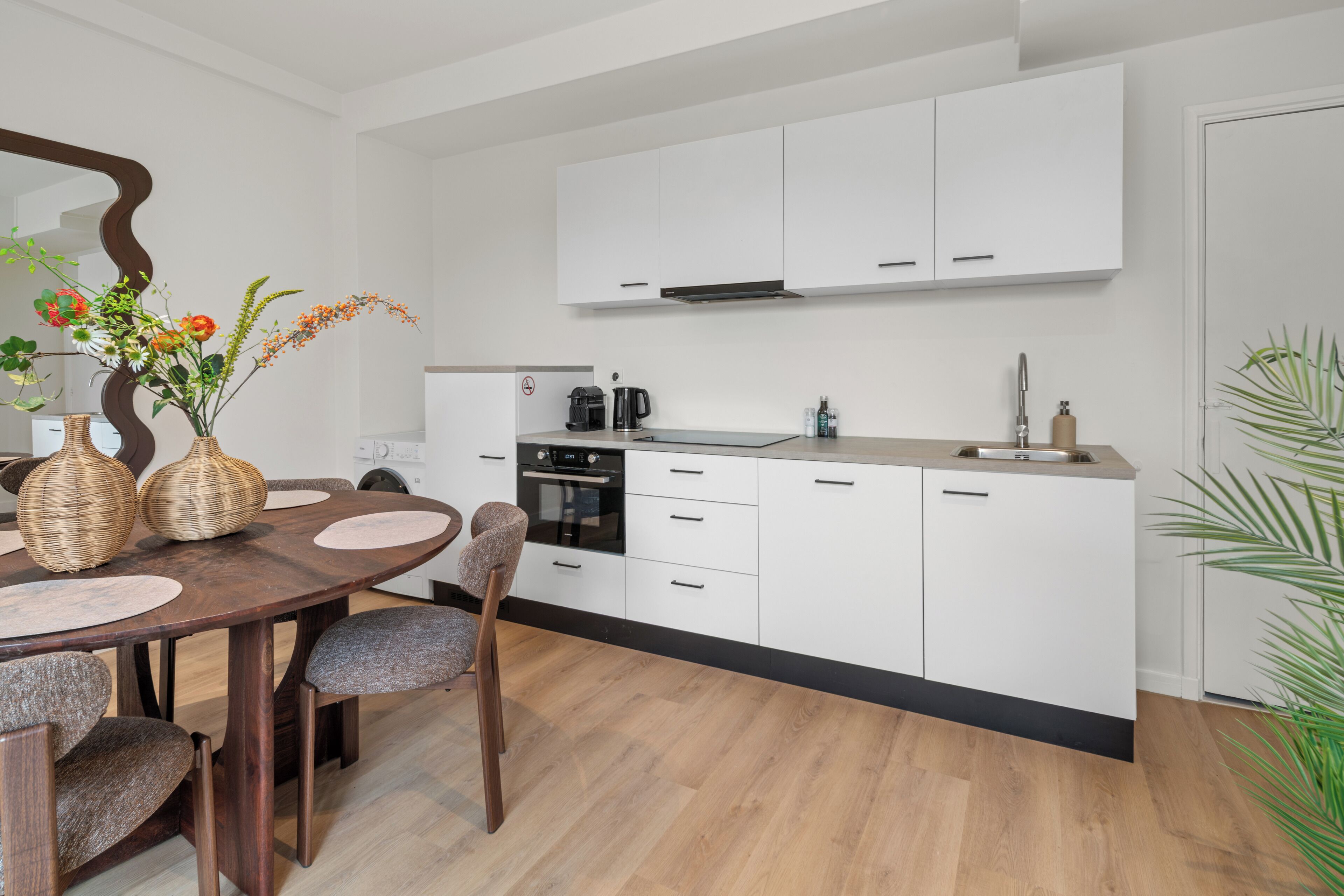 Modern private kitchen featuring an oven, microwave, dishwasher, and everything you need to prepare meals.