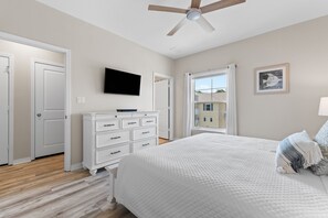 A bedroom with a bed, dresser, television, and a window with a view. - Welcome to the Turles Nest at Lost Key Golf & Beach Club (Perdido Key)