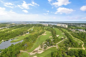 A golf course with multiple holes, a body of water, and surrounding greenery. - Welcome to the Turles Nest at Lost Key Golf & Beach Club (Perdido Key)