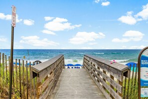 A wooden boardwalk leading to beach umbrellas and a sign indicating no parking. - Pet-Friendly Inlet Beach Home with Pool Access Near 30A (Inlet Beach)