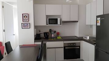 Fridge, microwave, oven, cookware/dishes/utensils