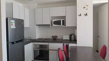 Fridge, microwave, oven, cookware/dishes/utensils