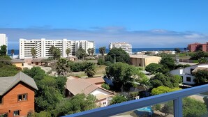 A residential area with multi-story buildings, a clear sky, and a view of the sea. - 5th-floor apartment in a condo. Pacific 2800 (La Serena)