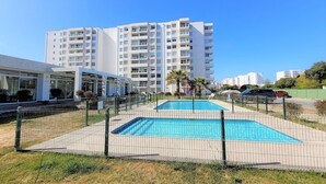A modern apartment building with a swimming pool and a covered area. - Dept. 3rd Floor, Pacífico 2800 (La Serena)