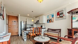 A compact living space with a kitchenette, dining area, and seating. - Dept. 3rd Floor, Pacífico 2800 (La Serena)