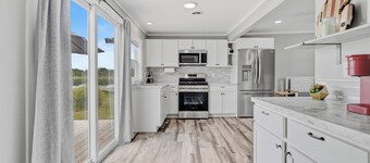 Peaceful 2-bedroom cottage on beautiful First Lake in Six Lakes, Michigan.