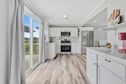 Peaceful 2-bedroom cottage on beautiful First Lake in Six Lakes, Michigan.