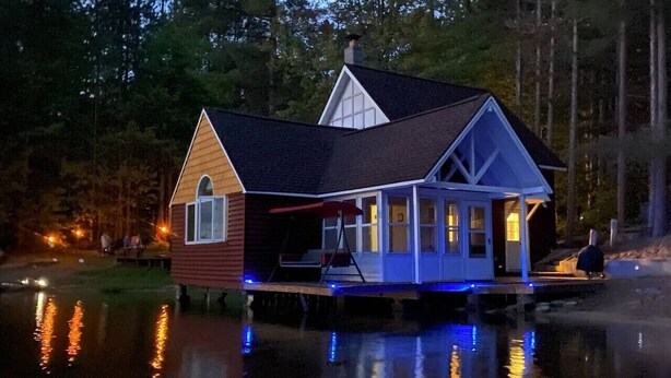 A house with a dock extending into a body of water, surrounded by trees. - Lost Lake Cottage

Munising/Wetmore (Munising Township)