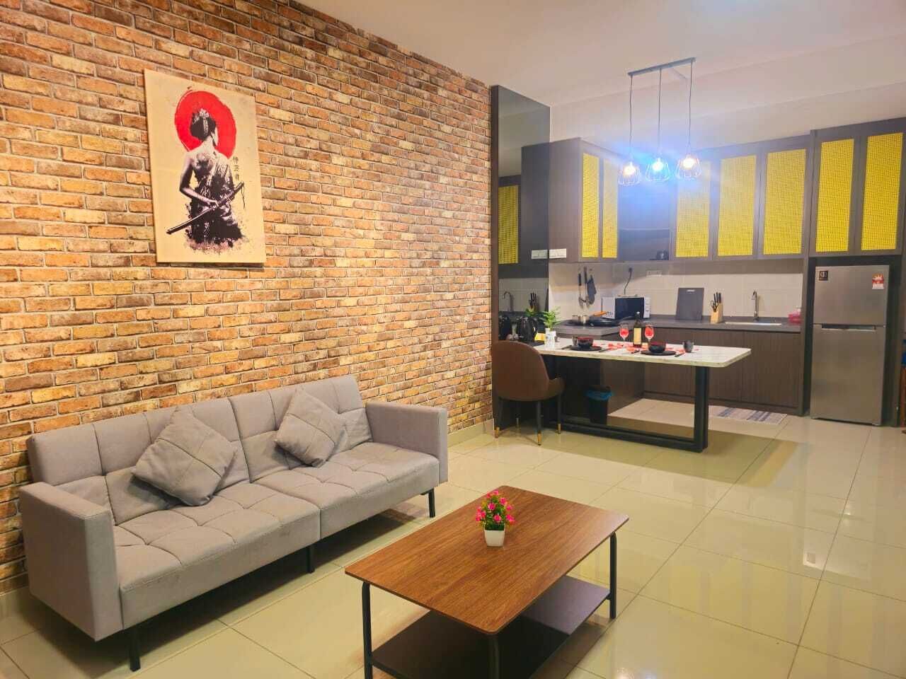 A living room with a sofa, coffee table, and a painting on the wall.