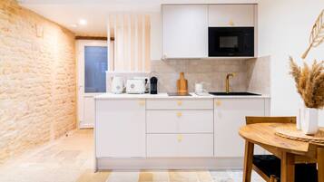 Fridge, microwave, coffee/tea maker, toaster