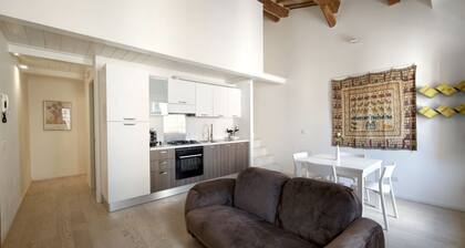 Welcome to the authentic heart of Jesi, one of the most charming towns in the Marche region.Located within the picturesque historic center, this elegant apartment is the perfect base for exploring the town on foot. Wander through centuries-old streets, l
