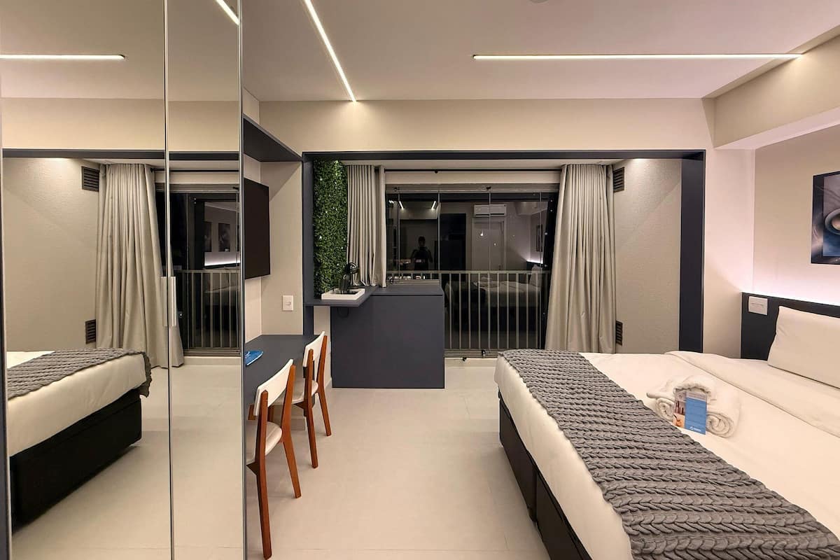 Deluxe Apartment | Desk, laptop workspace, blackout drapes, iron/ironing board