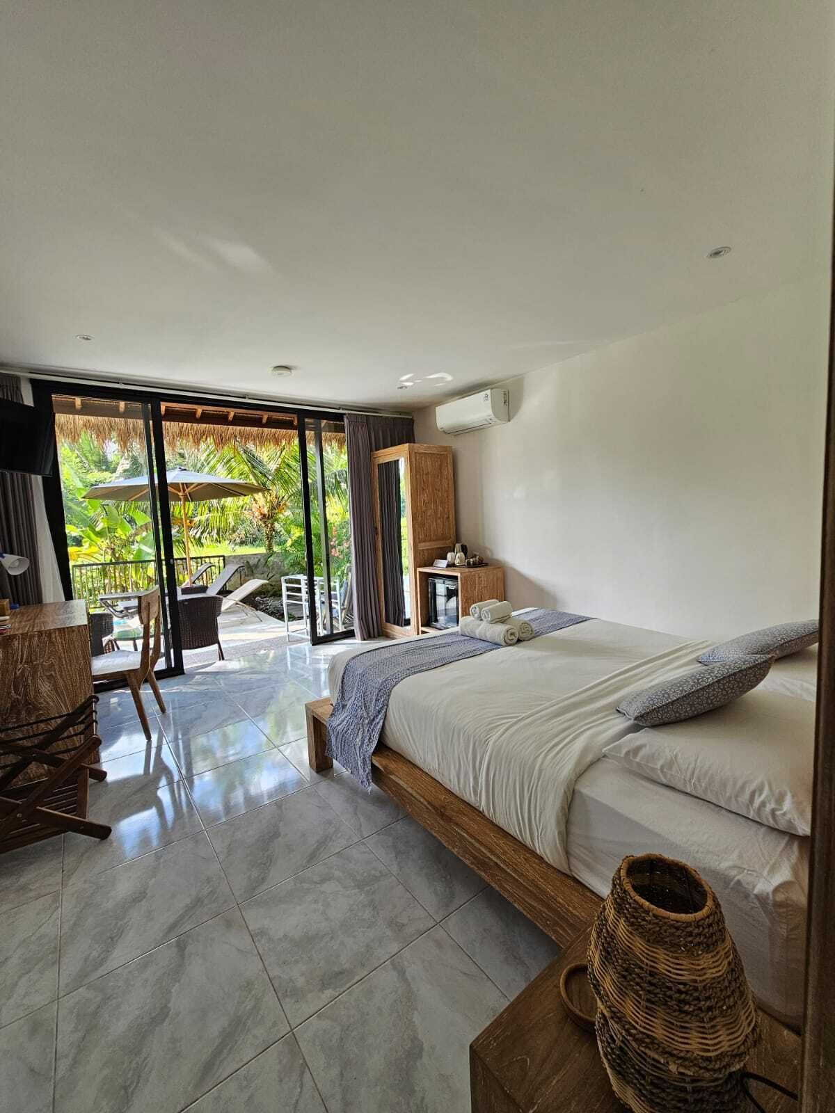 Junior Double Room, Pool View | In-room safe, desk, laptop workspace, iron/ironing board