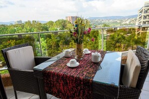Deluxe Apartment, 2 Bedrooms, Balcony, City View | Outdoor dining - Residency by La Maison Royale (Kigali)