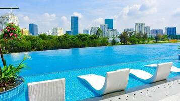 Outdoor pool, free pool cabanas, pool umbrellas