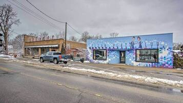 A street with a building labeled 'BREWERY' and another building with a colorful mural.